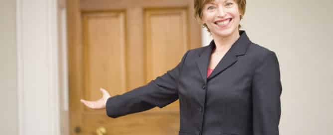 Lady gesturing to door