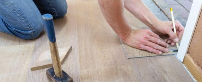 Person measuring floor material