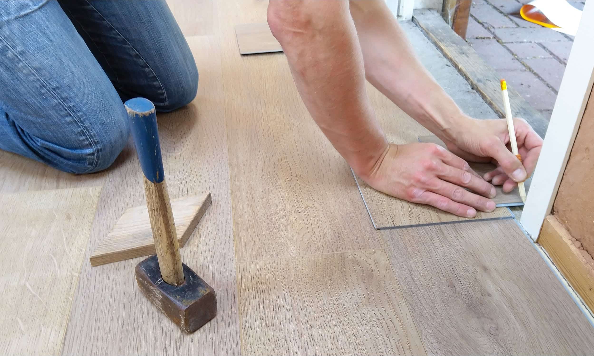 Person measuring floor material