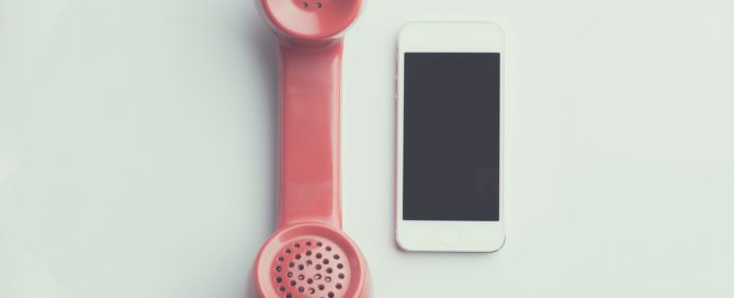 Landline phone next to smart phone