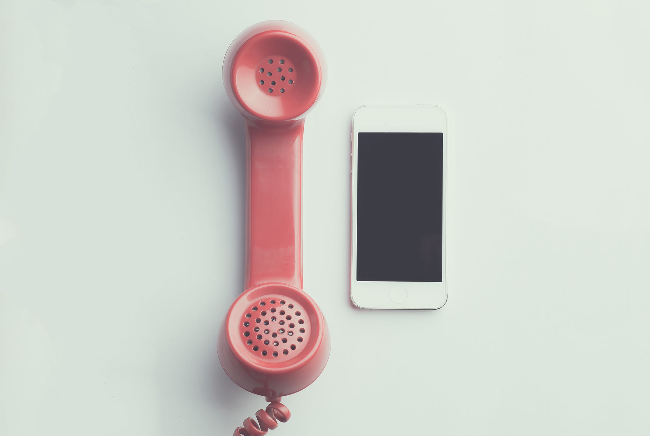 Landline phone next to smart phone