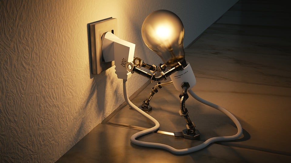Lightbulb with legs and arms plugging itself into a wall outlet