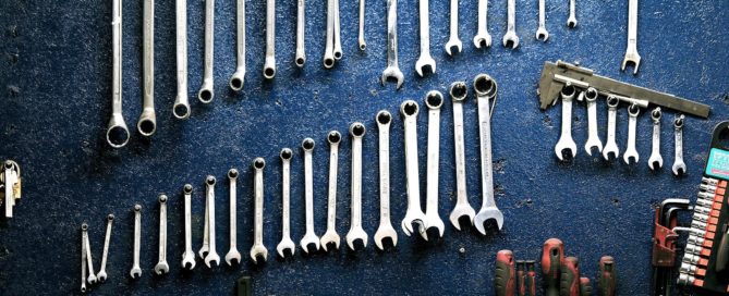 Neatly organized wrenches on the wall