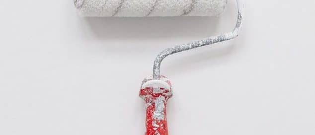 Paint roller covered in white paint