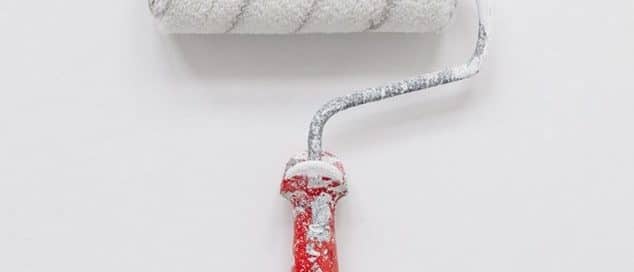 Paint roller covered in white paint