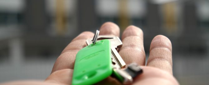 hand reaching out with keys in palm