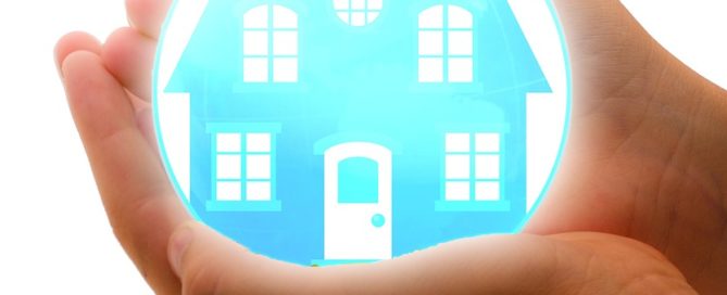 hands holding a house graphic