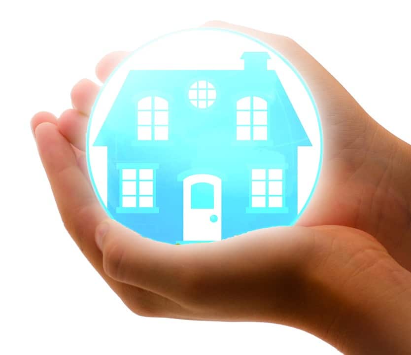 hands holding a house graphic
