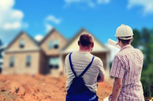 Contractors looking at house