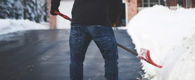 Person shoveling snow off their driveway