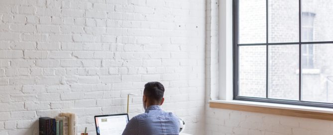 Man working on a laptop at a desk