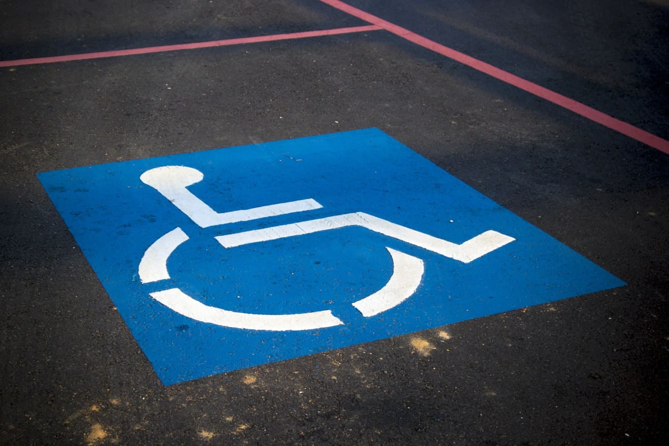 Handicap parking sign on pavement
