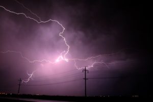 Purple lightning in the night sky