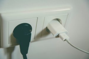 Cords plugged into wall outlet