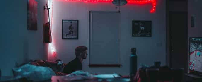 Bedroom with led light strips along the edges of the walls