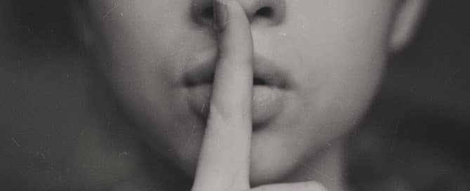 woman making the "quiet" gesture
