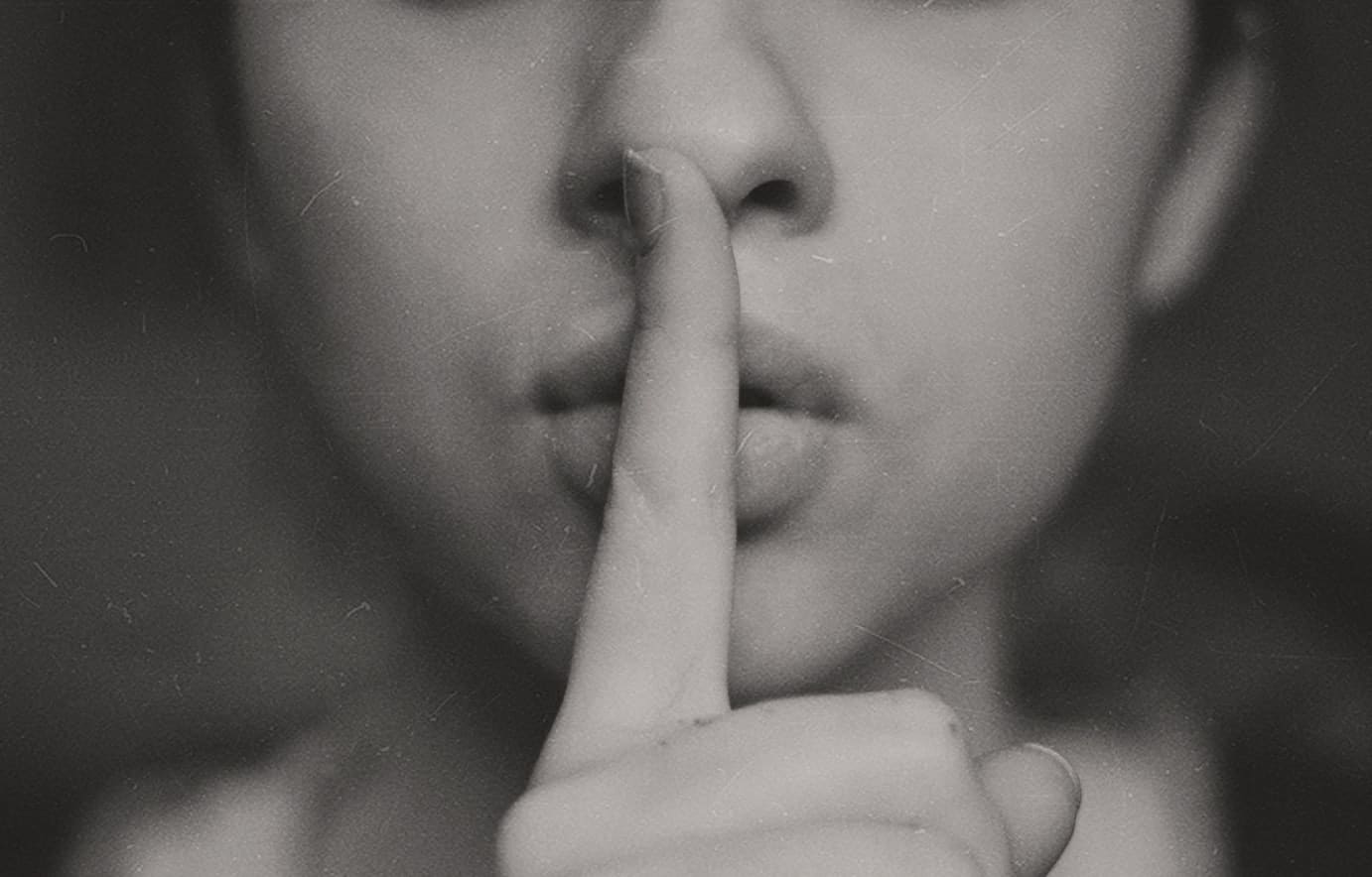 woman making the "quiet" gesture