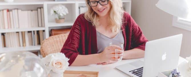 Woman sitting at a desk with her laptop