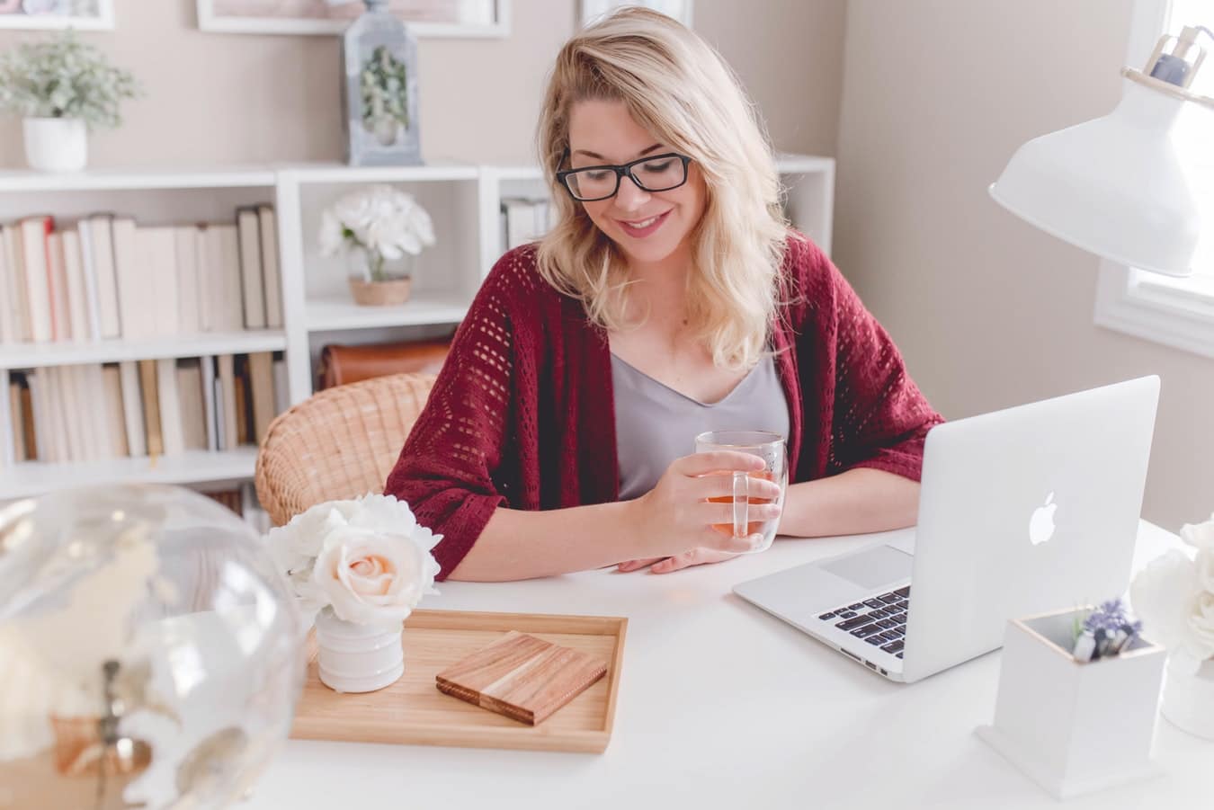 Woman sitting at a desk with her laptop