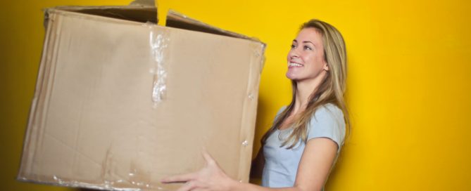 woman holding cardboard box