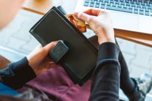 Person pulling card out of wallet