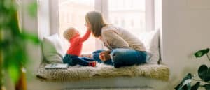 Woman playing with toddler