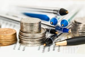 Piles of pens and coins