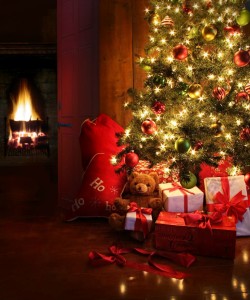 Christmas tree with tree gifts and fire in background